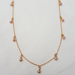 Dainty pink pearl charm necklace