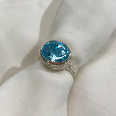 Etched Oval Sky Blue Topaz ring