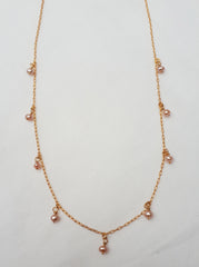 Dainty pink pearl charm necklace